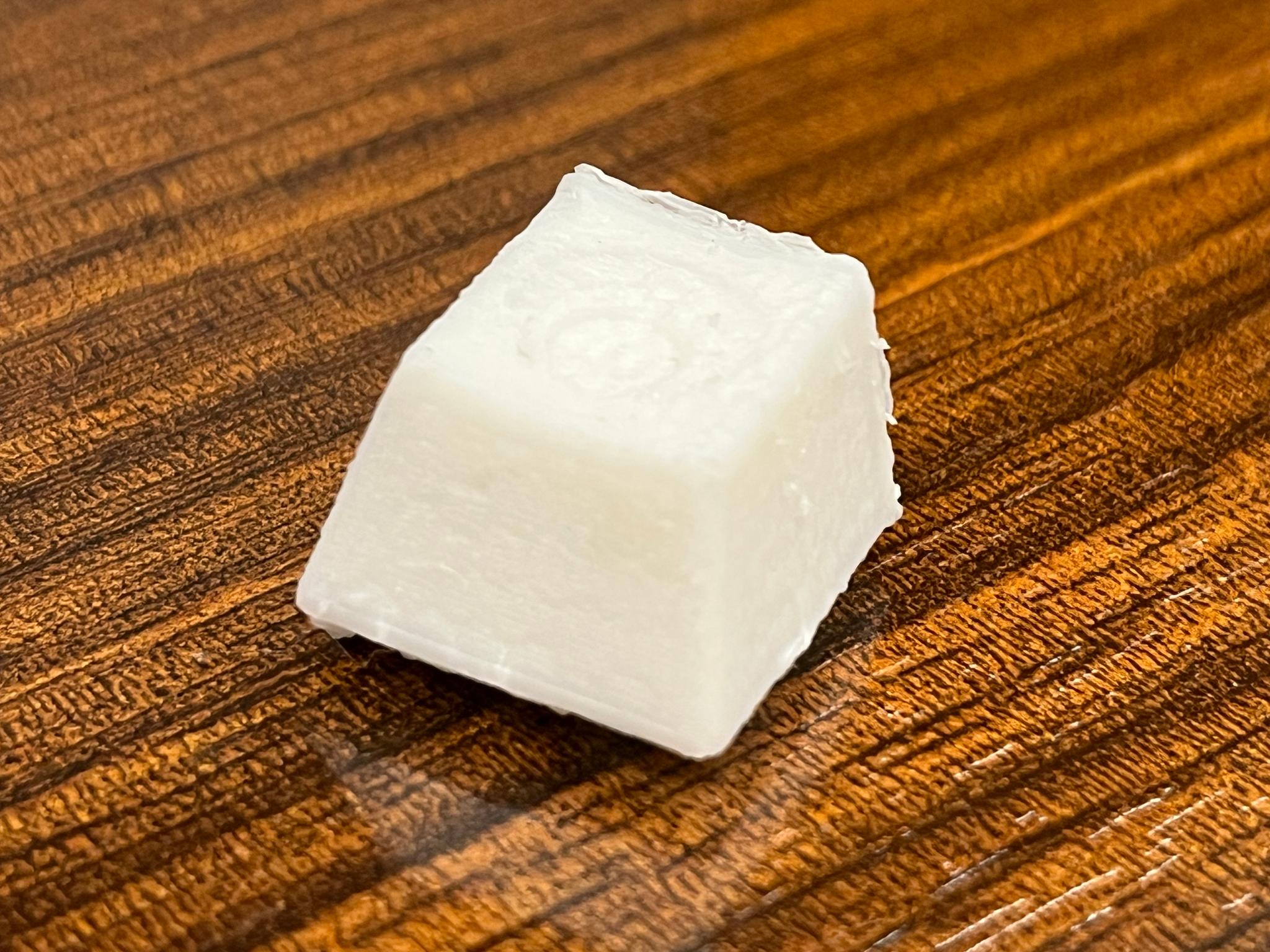 Top view of white Turkey Keycap printed with dremel